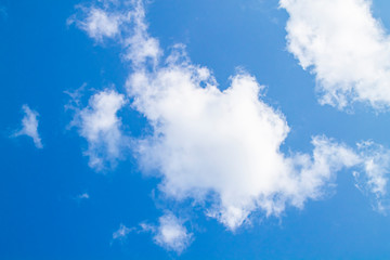 white clouds against the blue sky.