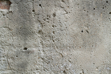 texture of concrete wall, ragged plaster with cracks, background for designers