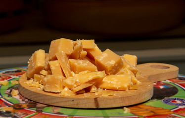 Tasting of old Dutch organic cheese in blocks outside cheese shop
