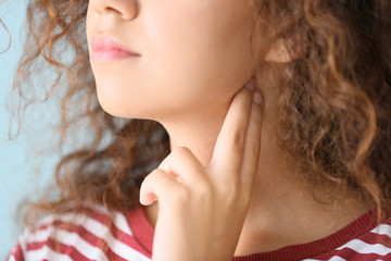 African-American woman checking her pulse, closeup