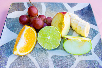Several fruits cut on a plate