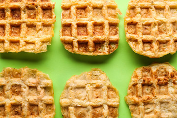Tasty waffles on color background