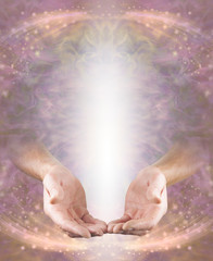 Humble Pranic Healer Message Board - male hands in open giving position with shaft of white light above on a pink peach ethereal energy flowing sparkling background with copy space