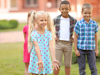 Portrait of cute little children in park