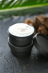 Jar of natural cream on dark background