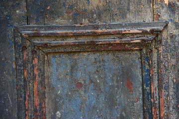 Old board with blue peeling paint