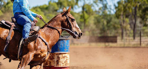 Horse And Rider Competing In Barrel Race At Outback Country Rodeo