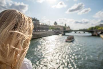 Fototapeta premium Girl watching Boats on Seine, Paris