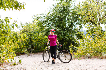 Naklejka premium girl on bike sunset summer sun
