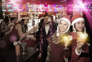 Obraz na płótnie Canvas Girls on new year eve party in bar