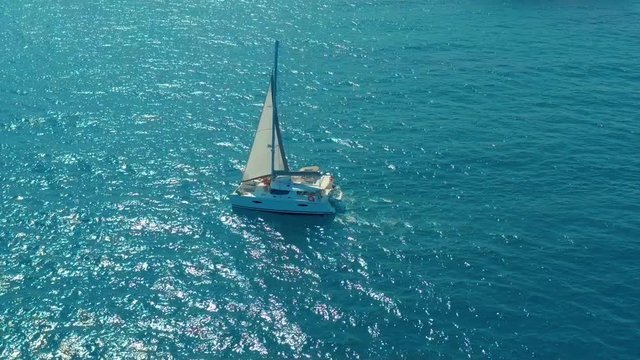 Aerial view. Large sailing catamaran in the open sea.