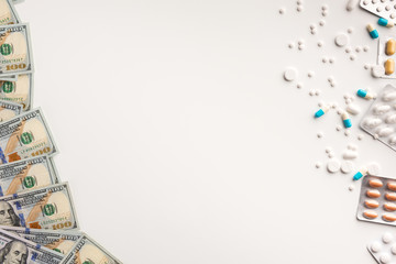 Medicaments and money isolated on white background