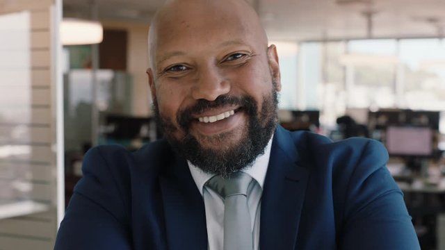 portrait african american businessman smiling confident manager in corporate office attractive male executive enjoying successful career in business management professional at work