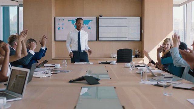 businessman presenting successful solution to shareholders celebrating with applause congratulating executive for growth in sales clapping hands in office boardroom meeting 