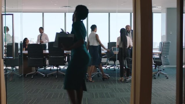 diverse business people meeting in boardroom brainstorming colleagues discussing strategy sharing problem solving ideas working on deadline collaborating in busy office 4k