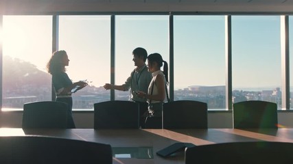 business people shaking hands consultant greeting international clients with handshake planning partnership deal female executive meeting shareholders in corporate office at sunset - Powered by Adobe