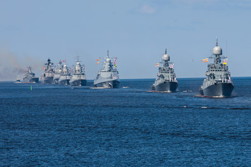 A line ahead of modern russian military naval battleships warships in the row, northern fleet and...
