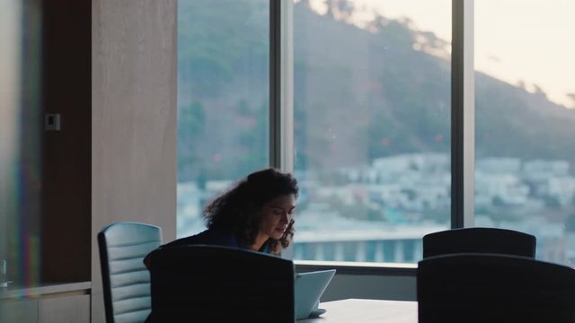 independent business woman looking out window planning ahead thinking of ideas for future investment strategy corporate manager working late enjoying leadership career in office