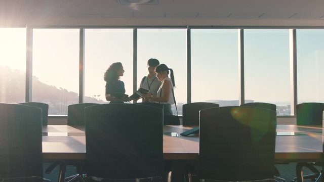 business people shaking hands consultant greeting international clients with handshake planning partnership deal female executive meeting shareholders in corporate office at sunset