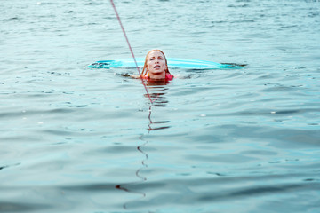 Beautiful blonde Caucasian woman in a life jacket