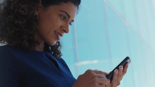 independent business woman using smartphone texting female executive checking emails browsing messages on mobile phone in office