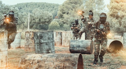 Group of people playing paintball