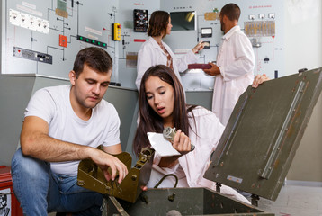 Girl and guy with box in escape room