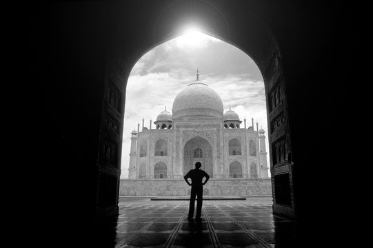 Rear view of man standing in front of Taj Mahal