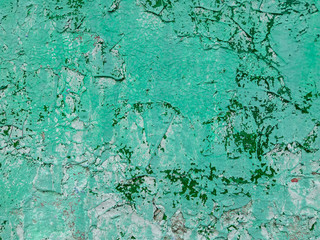 green blue turquoise concrete wall with deep relief and shadows. rough texture surface