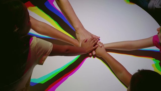 colorful hands children celebrating teamwork multicultural celebration of global community multicolor light creative equality concept 4k