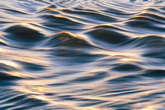 Close up of sunlight reflecting on ocean waves