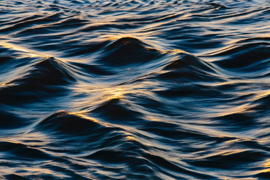 Close up of sunlight reflecting on ocean waves
