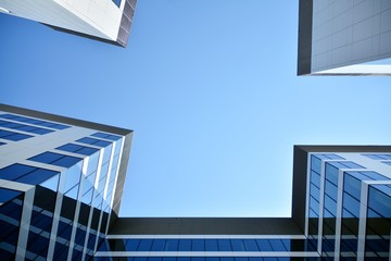 Fototapeta na wymiar modern office building with blue sky and clouds