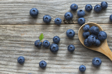 Blueberries on wooden background, fresh and healthy snack