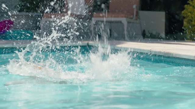 happy dog jumping in swimming pool playing game fetching toy ball golden retriever playfully enjoying summer cute furry canine having fun splashing 4k