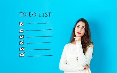 To do list with young woman in a thoughtful face