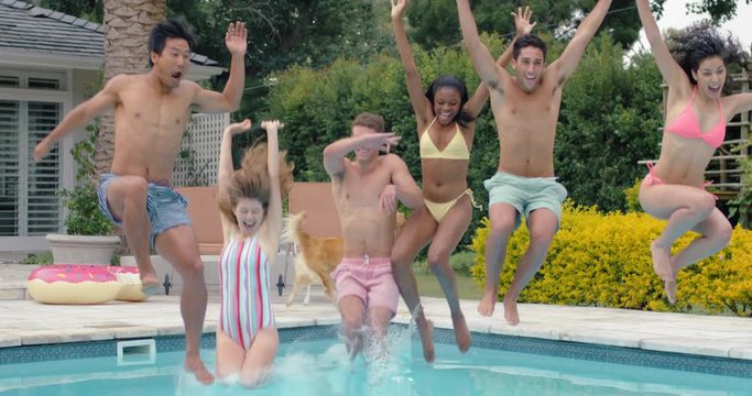 friends jumping in swimming pool having fun celebrating summer vacation together  group of teenagers enjoying pool party on sunny day spring break celebration 4k
