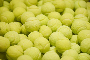 yellow bubblegums in a tennis ball shape in a French sweets shop