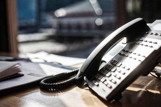 Close up of telephone on desk in office