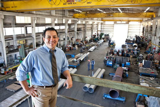 Portrait of manager standing in factory