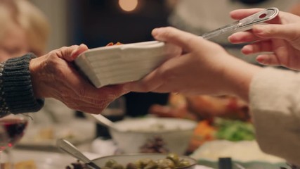 happy family christmas dinner sharing delicious homemade meal at festive celebration sitting at table enjoying feast celebrating holiday at home with friends 4k footage