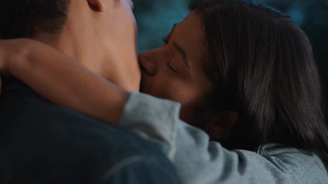 happy teen couple first kiss beautiful teenage girl kissing boyfriend outside home enjoying romantic evening date 4k footage