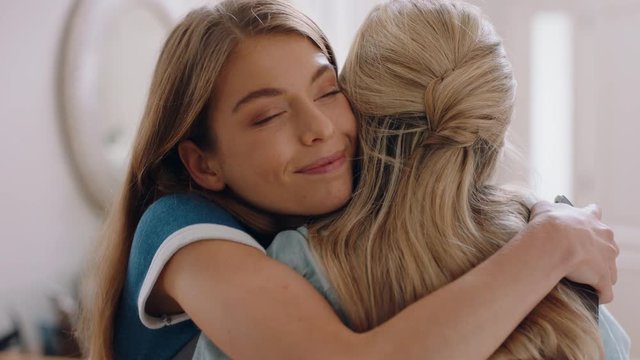 beautiful teenage girl hugging mother congratulating daughter successful achievement excited mom feeling proud parent enjoying family connection at home 4k footage