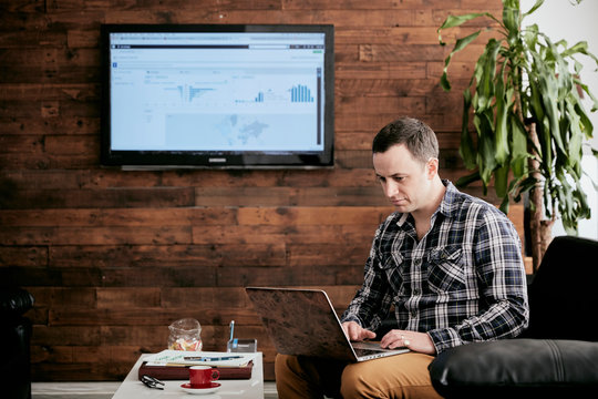 Businessman working on laptop in office