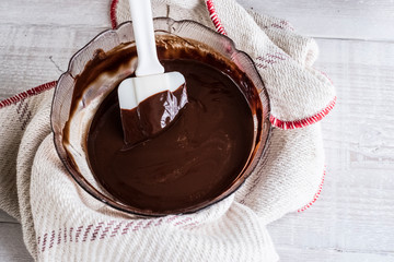 Close up of bowl of melted dark chocolate in bowl