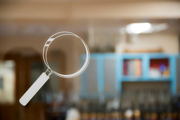 magnifying glass on the glass window of a science lab