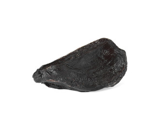 Obraz premium Clove of aged black garlic on white background