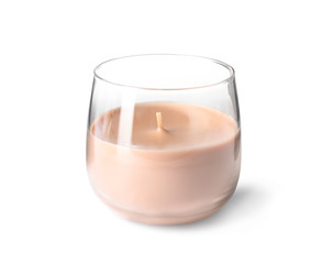 Orange wax candle in glass holder isolated on white