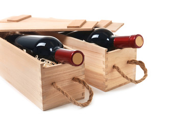 Wooden crates with expensive wine isolated on white