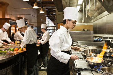 Chefs working in commercial kitchen